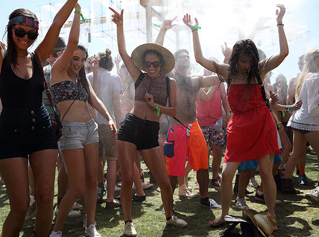 festival goers sprayed with water